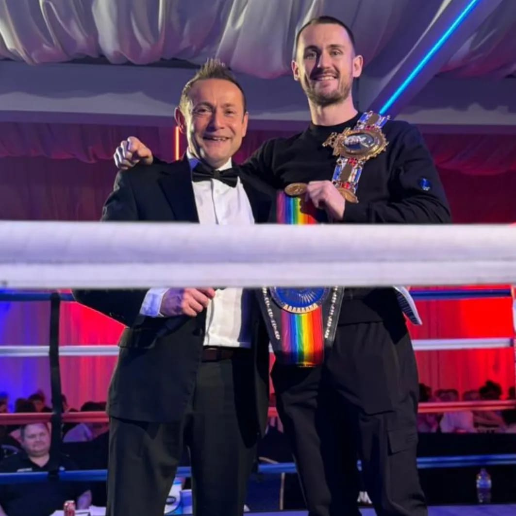 Nick Mummery with a championship-belt winner at a boxing event