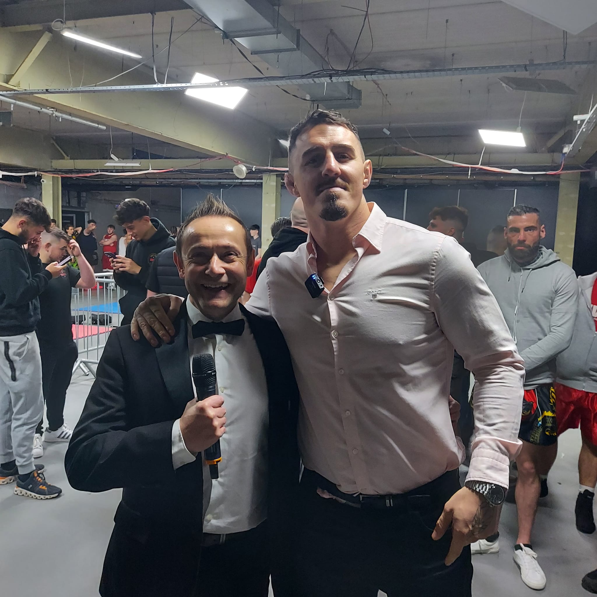 Nick Mummery with Tom Aspinall at a combat sports event